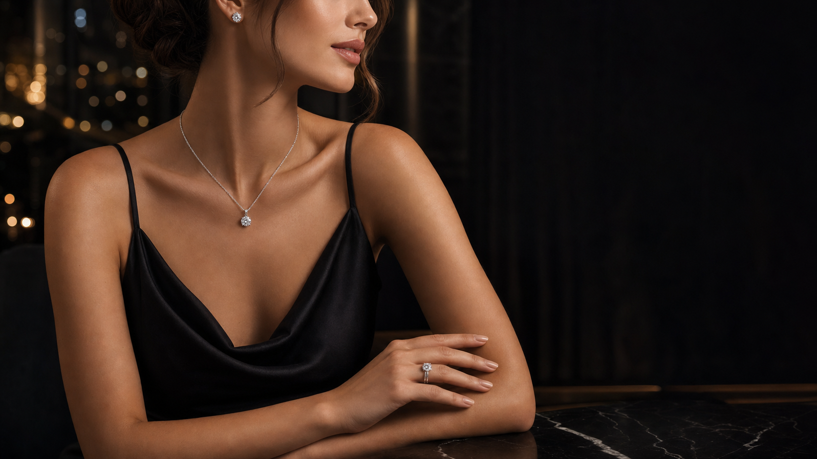 Model wearing lab-grown diamond earrings, necklace, and ring in a luxury evening setting
